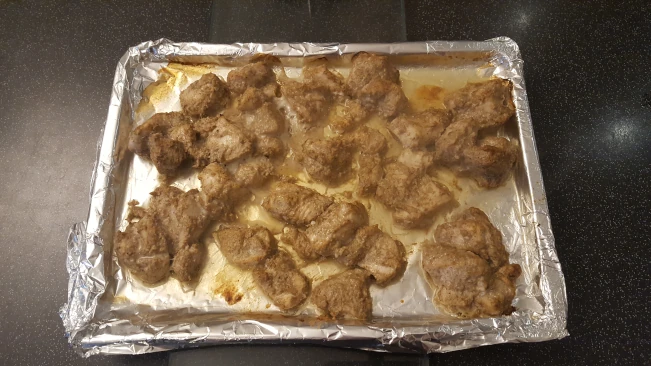 cooked chicken chunks on tray