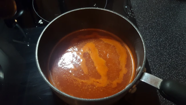 chilli sauce simmering in a pan