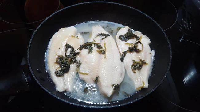 fish fillets cooked in a pan