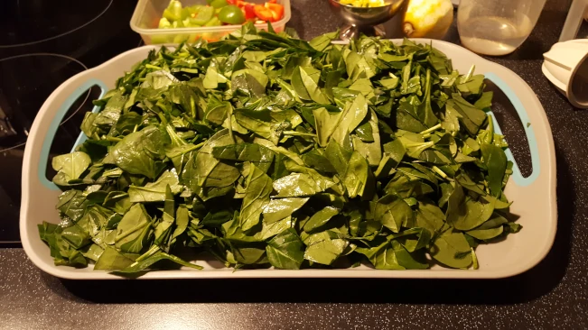 chopped spinach on a tray