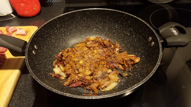 onions and spice paste cooking