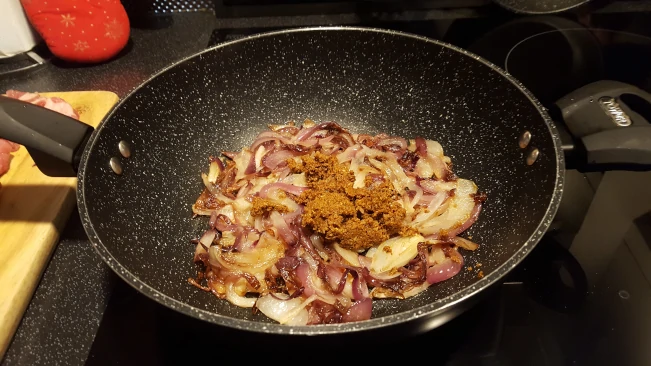 spice paste added to onions