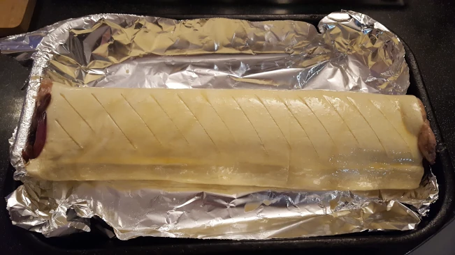 raw sausage roll egg washed for sausage roll & caramalised onion raw sausage roll egg washed