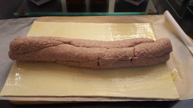 sausage filling on pastry for sausage roll & caramalised onion sausage filling on pastry