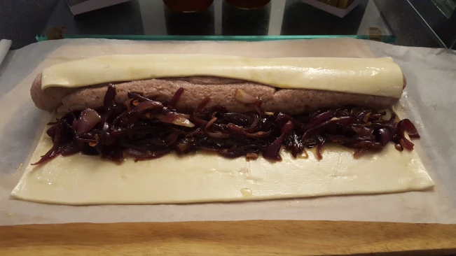 wrapping filling in pastry for sausage roll & caramalised onion wrapping filling in pastry